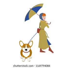 Young beautiful Woman with umbrella walks with cute corgi on rainy day