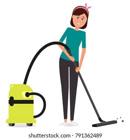 Young beautiful woman vacuuming the floor.