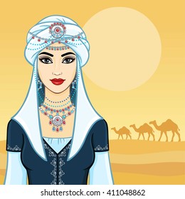 The young beautiful woman in a white turban and silver jewelry. Background - the desert, a caravan of camels.
