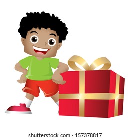 Young black boy posing with a big present