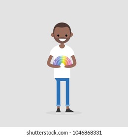 Young black character playing with a rainbow spring toy / flat editable vector illustration, clip art