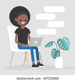 Young black female character typing messages on a laptop. Remote communication. Modern lifestyle. Copy space. Flat editable vector illustration.