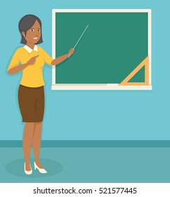 young black female teacher teaching in front of the classroom