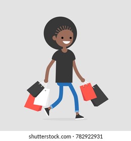 Young black female trendy character walking with the shopping bags / flat editable vector illustration