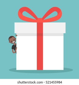 Young black man peeping from behind a giant gift box / Copy space. Editable flat vector illustration, clip art