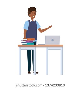 young black teacher in desk with laptop and books