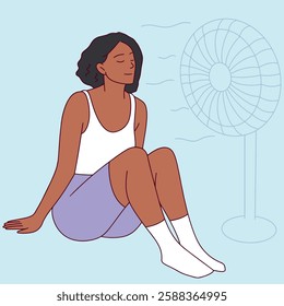 A young Black woman with short curly dark hair sits in front of a fan on a hot summer day. She wears a white tank top, purple shorts, and white socks, enjoying the cool breeze. The background