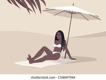 Young black woman sitting on the beach under umbrella, summertime vacation, hot tropical climate