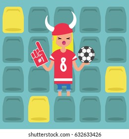 Young blond girl wearing horned hat and foam finger at the stadium / flat editable vector illustration, clip art