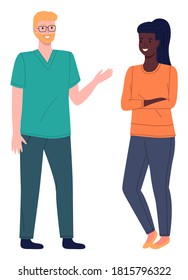 Young blond veterinarian or doctor with glasses talking to smiling girl patient or owner of pet. Medical specialist in a special uniform. Surgeon, therapist, pet doctor. Veterinary medicine concept