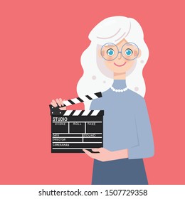 Young blonde girl with сlapperboard in the studio, production movie film.