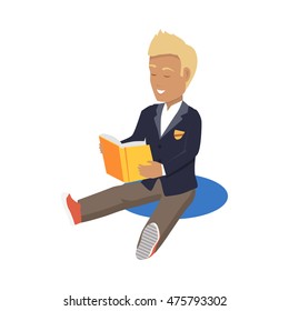 Young blonde haired happy man student enjoying reading big thick book. Student sits and reads a book. Boy is a reading big book. Reading kid. Reading student. Kid reading open book sitting on floor