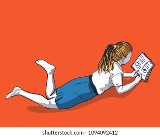 Young blonde woman and reading book on orange background.