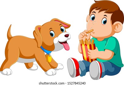 Young boy eating french fries with a dog