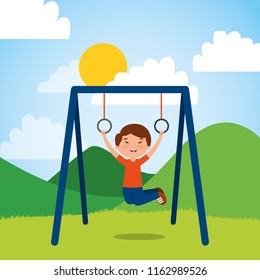 young boy hanging rings bar in the park sunny day