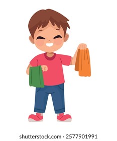 Young boy holding colorful clothes