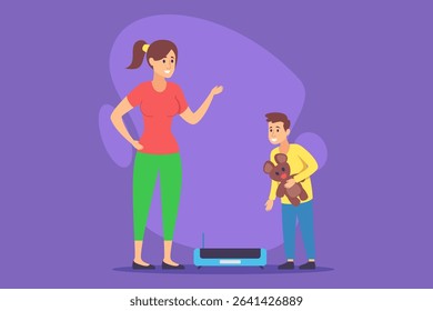 Young boy holding teddy bear and interacting with robotic device on floor as his mother standing nearby, engaging in conversation, in brightly colored room