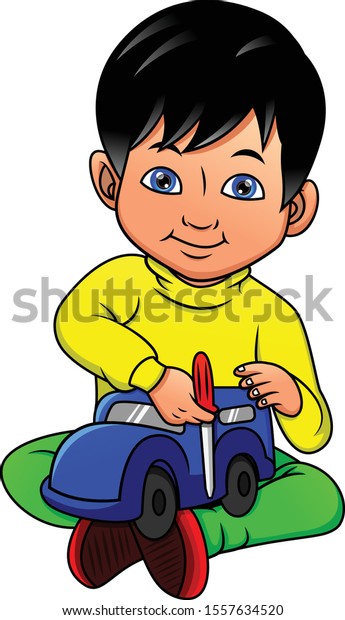 Young boy playing car\
toy