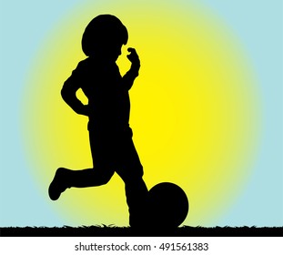 Young boy playing football