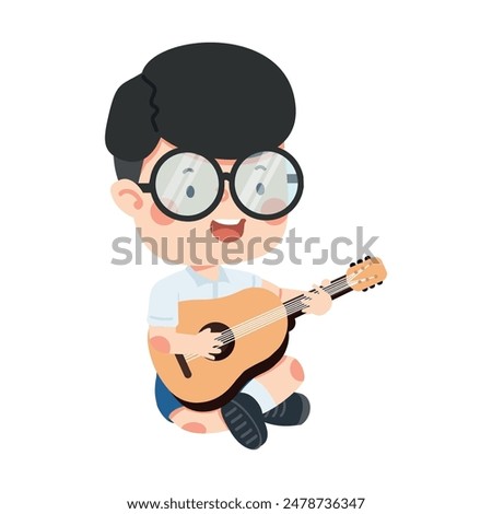 A young boy playing the guitar