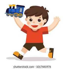 A young boy playing his blue train toy