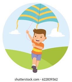 young boy playing kite in the field