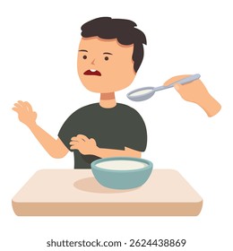 Young boy is refusing to eat his soup, pushing the spoon away with a scared expression on his face