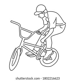 Young boy showing off freestyle trick with bicycle