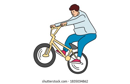 Young boy showing off freestyle trick with bicycle