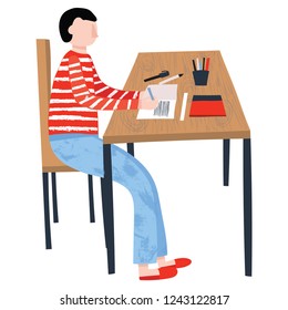 Young boy sitting at table, reading and writing at home. Homeschooling concept. Education, self-learning, self-study