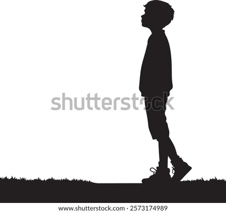 A young boy is standing on grass Silhouette design