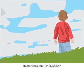 Young boy standing at the top of a grassy hill with large coloud of white clouds