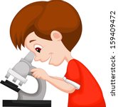 Young boy using microscope