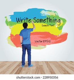Young boy write something on colorful painted brush area in room space. Vector abstract background for creative art design.
