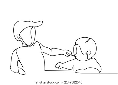 a young brother is feeding his little baby brother