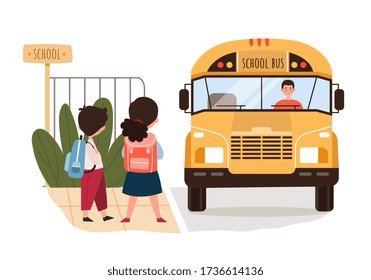 Young brother and sister waiting for a traditional yellow school bus at the edge of the street watching it approach, colored vector illustration