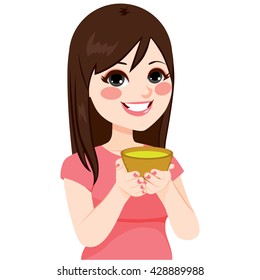 Young brunette Asian woman having healthy green tea