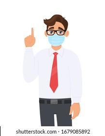 Young business man covering face with medical mask and pointing finger up symbol. Trendy person wearing facial hygienic surgical mask and gesturing hand sign. Cartoon design illustration in vector.