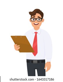 Young business man in eye glasses holding clipboard or document folder. Trendy person keeping notepad or report. Male character design illustration. Business service concept in vector cartoon style.