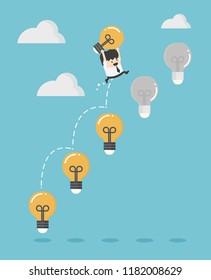Young business man holding a dollar jump light bulb the to succeed.