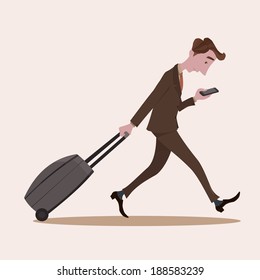 Young business man pulling the luggage busy with mobile phone