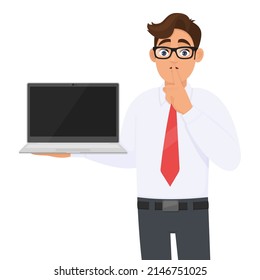 Young Business Man Showing Laptop And Finger On Lips. Person Carrying Computer And Asking Silence. Male Character Holding Digital Technology Device. Modern Lifestyle Illustration In Vector Cartoon.