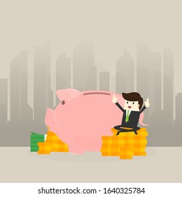 Young Business man sit money coin and show 
Thumbs up with piggy bank,saving concept.