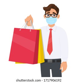 Young business man wearing medical mask and holding shopping bags. Person in eye glasses carrying paper packages. Healthy modern lifestyle. Male character illustration design in vector cartoon style.