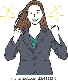 A young business woman in a suit doing a fist pump