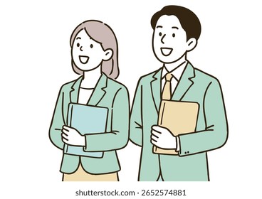 Young Businessman and Businesswoman Holding Documents and Laptop
