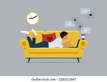 Young businessman character lying on the sofa and typing on a laptop, working from home concept.
