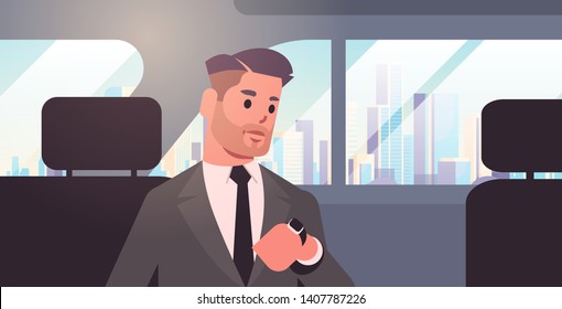 young businessman looking at clock checking time business man car passenger sitting on back seat in taxi cab city transportation service concept flat portrait horizontal