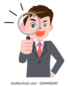 Young businessman looking through magnifying glass