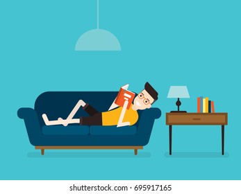 Young businessman lying on sofa and reading a book, flat design vector